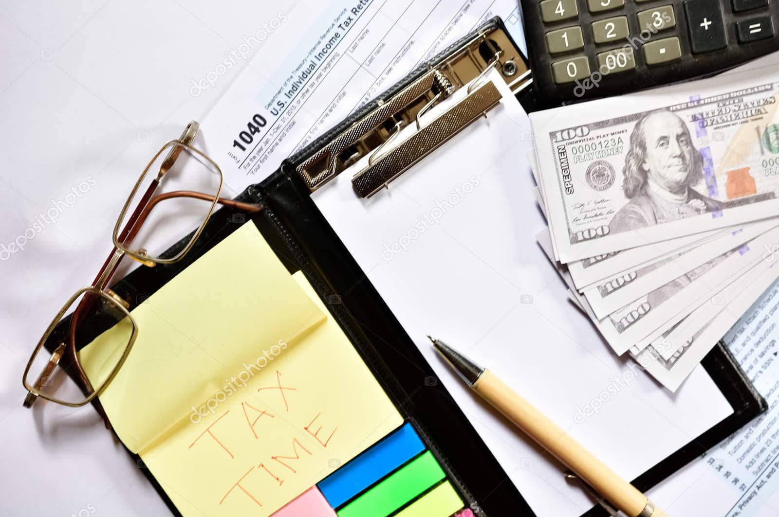 Financial planning tools including tax documents, calculator, and cash for retirement strategies.